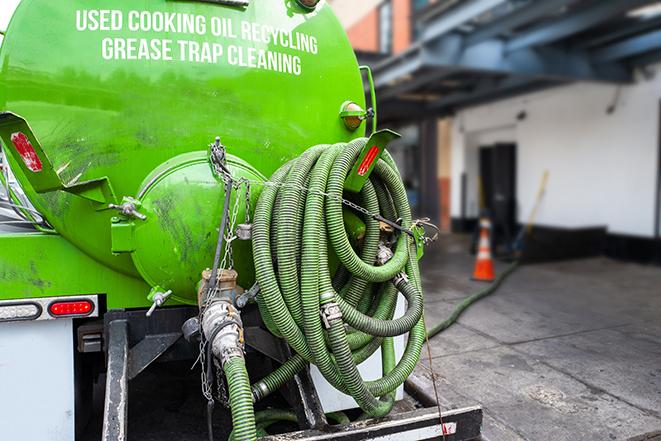 pump truck removing waste from a grease trap in Beaumont, CA